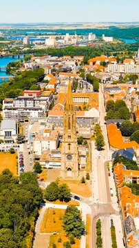 Vertical video. Metz, France. Temple de La Garrison de Metz. View of the historical city center. Summer, Sunny day. Drone footage. Rich colors