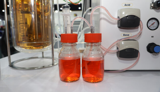 Laboratory bioreactor system with acid and base reagent bottles