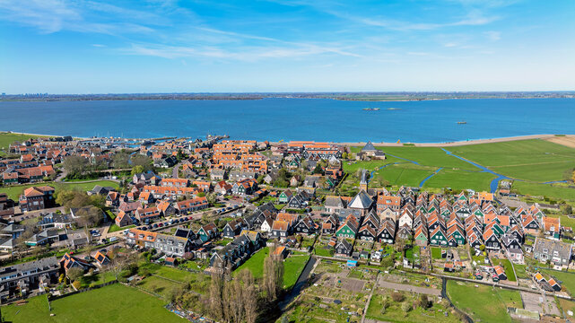 Aerial view of the historic village of Marken with its traditional wooden houses, narrow streets, and harbor situated along the Markermeer.