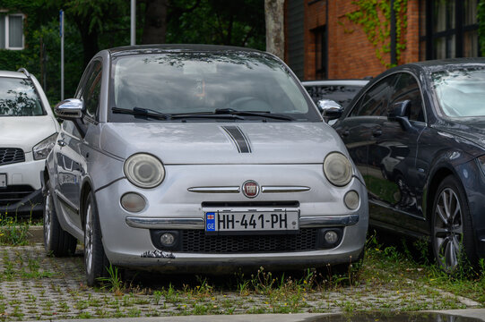 August 15, 2026, Tbilisi, Georgia Editorial stock photography of a silver Fiat 500 compact city car parked in an outdoor urban lot