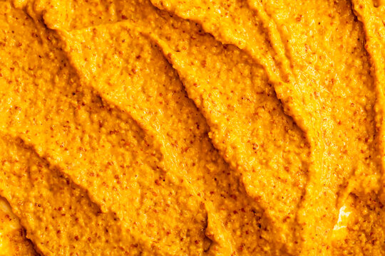 Smoothie of fresh fruits and berries, orange, banana, mango, sea buckthorn, cloudberry. Ice cream texture. Fruit yogurt ice cream. Delicious sweet dessert close-up as a background.