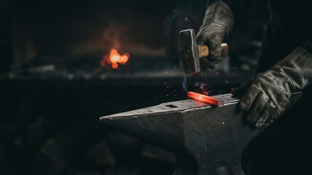 Blacksmith hammering hot metal on anvil in workshop setting