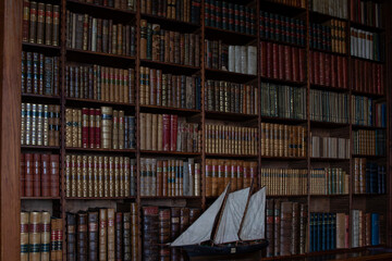 Model Sailboat in Library Bookshelves at Dunrobin Castle, Scotland, UK. © iSky Media