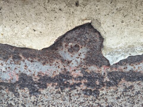 Peeling paint over corroded iron macro background for creative graphic asset overlay
