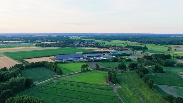 Solar panel at agricultural farm with biogas plant and silage clamps storage. Sustainable renewable energy. Photovoltaic technology for eco-friendly electricity production. Solar power station