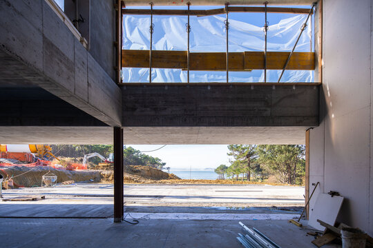 Stone architecture under construction with ocean view