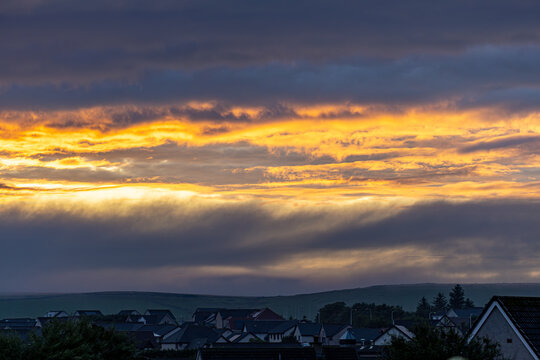 Sunset Cloudscape Over Residential Area in Thurso, Scotland, UK.