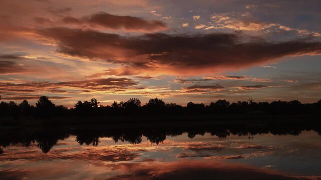 Beautiful Sunrise over Water Timelapse Zoom In