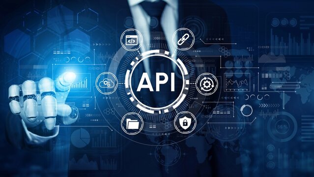 Businessman in Suit Interacting with Technology Interface Displaying API Symbols and Data Analytics Concepts for Digital Transformation and Innovation. Entropy.