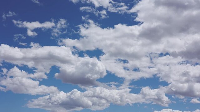 Blue Sky and Puffy Clouds Timelapse Background
