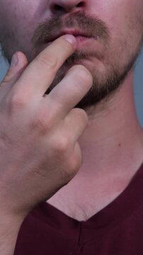 Man eats pastry in close up, showing enjoyment of food and flavors