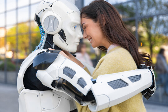 Cheerful woman embracing white robotic companion