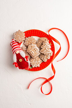 Homemade Christmas gingerbread cookies with festive red ribbon