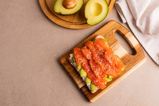 Open sandwich with salmon avocado cucumber and cream cheese