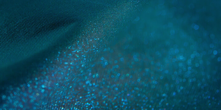 Abstract blue fabric texture with sparkling bokeh light