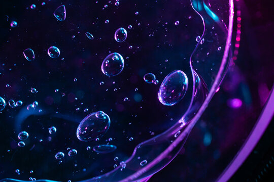 Neon microscopic bubbles in fluid science concept background