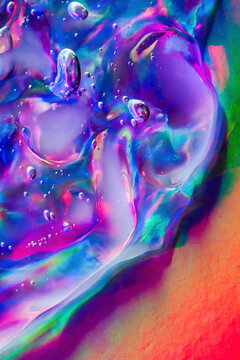 Iridescent liquid bubble texture with vivid neon colors