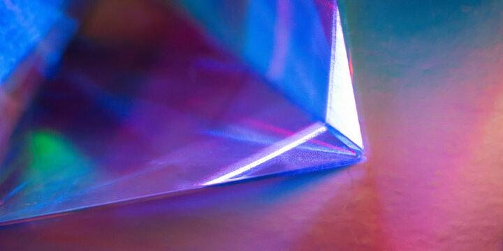 Futuristic holographic prism with neon tech background