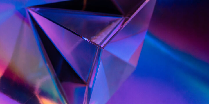 Futuristic geometric glass prism with neon abstract background