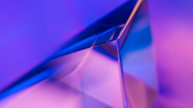 Futuristic abstract glass prism with neon light background