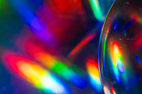 Futuristic rainbow light refraction through glass lens
