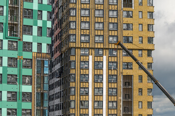 Fototapeta premium Construction of modern high-rise buildings in an urban setting showcases innovative design and emerging architecture