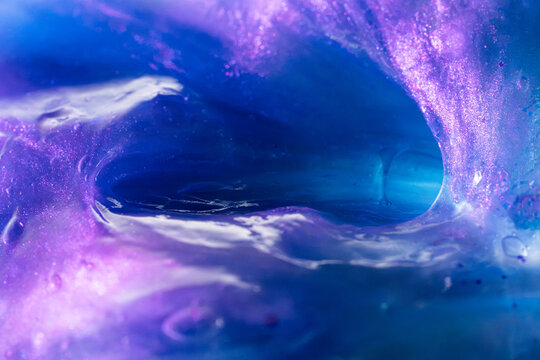 Abstract blue and purple liquid tunnel background
