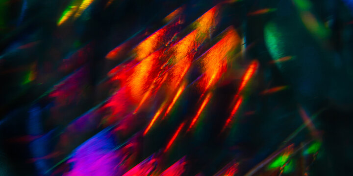 Abstract multicolor light streaks on a dark background