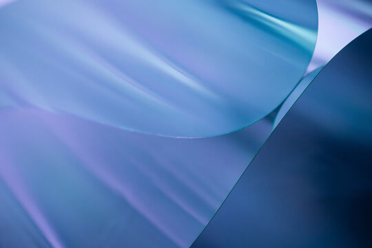 Abstract blue translucent curved shapes with soft gradient