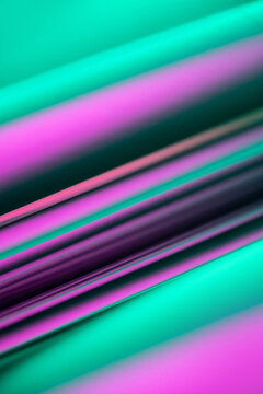Abstract turquoise and magenta diagonal light streak background