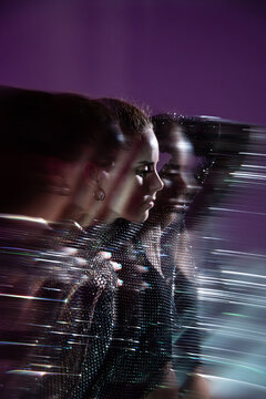 Woman portrait with motion blur and futuristic light trails