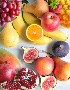 Fresh fruits mixed. Tasty fruits background, citruses, apples, grapes.