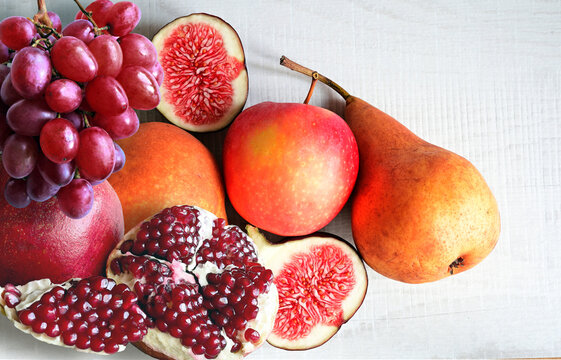 Fresh fruits mixed. Tasty fruits background, citruses, apples, grapes.