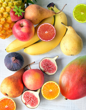 Fresh fruits mixed. Tasty fruits background, citruses, apples.