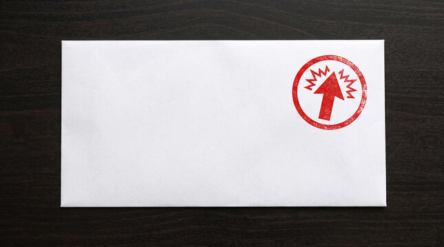 White envelope with red stamp symbolizing progress and growth