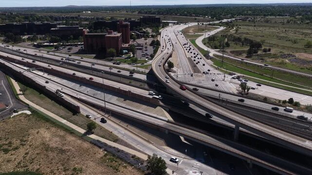 Aerial of transportation hub and rail lines in Aurora Colorado at Parker Road and I225 on sunny summer day
