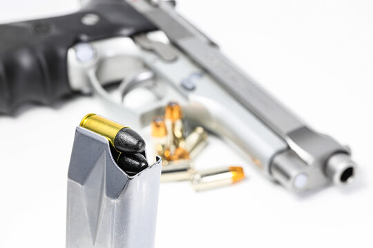 bullet 9mm parabellum Teflon Coating LRN ( lead round nose ) in magazines and 9mm postal gun in background.