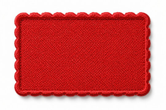 Blank red fabric patch with stitched border for branding or labeling on transparent background