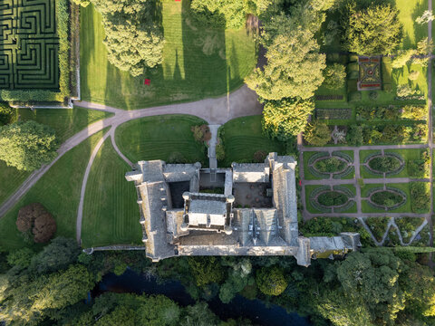 Top-down aerial drone photo of Cawdor Castle, formal gardens, hedge maze, and surrounding estate grounds near Nairn in Highland, Scotland