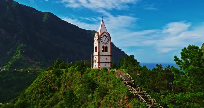 Aerial view of a beautiful chapel in the very picturesque village of Sao Vicente on the island of Madeira, situated on a hillside in a lovely green valley by the Atlantic Ocean