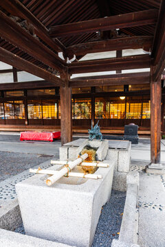 Traditional dragon water fountain at Kodaiji Temple area Kyoto used for ritual purification in Japanese culture, Kyoto, Japan 