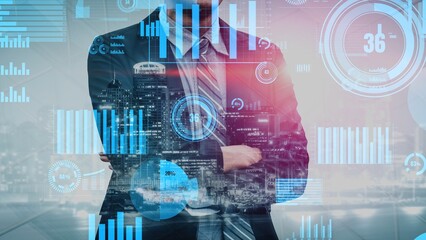 A professional businessman stands confidently with crossed arms, surrounded by digital graphs and data visualizations, highlighting modern business strategies in an urban setting. Xenic © InfiniteFlow
