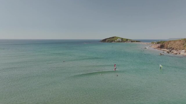 Windsurfers over Bantham Beach and River Avon from a drone, South Hams, Devon, England