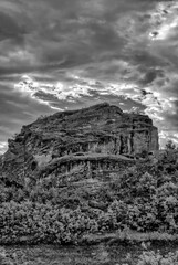Fototapeta premium Black and White Rock Formation Under Dramatic Sky
