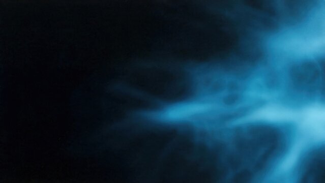 Ethereal blue mist swirls and dissipates into darkness on the right side