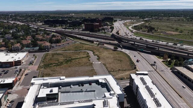 Aerial of suburban infrastructure along interstate 225 and Parker Road in Aurora Colorado in summer