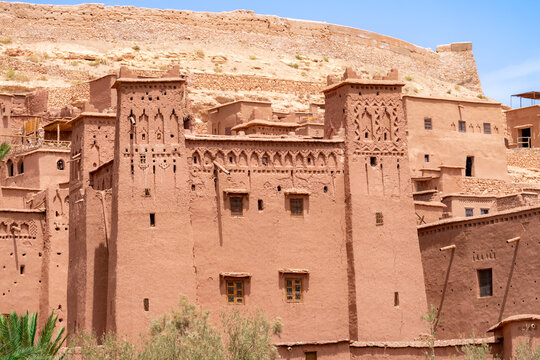 Ait Benhaddou ksar in Morocco with fortified mud brick kasbahs and textured earthen walls a preserved UNESCO Berber village bathed in clear desert sunlight