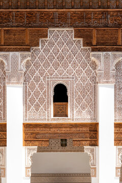 Ben Youssef Madrasa showcasing rich Moroccan Islamic architecture with carved cedar wood ornate stucco patterns and geometric designs highlighting historical craftsmanship and cultural heritage
