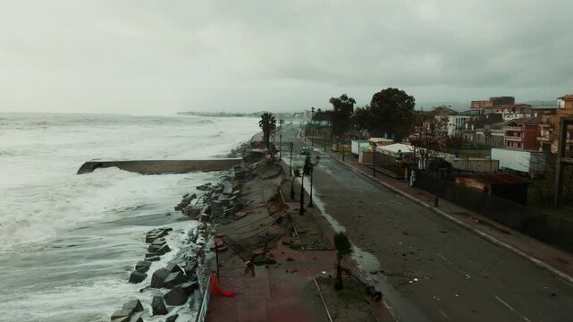 Seafront Road and buildings destroyed by storm surge caused by climate change