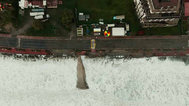 Seafront road buildings destroyed by climate change, furious ocean waves